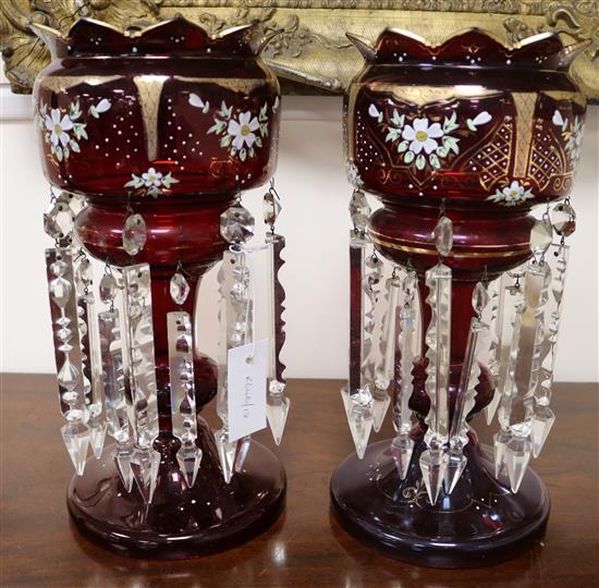 A pair of enamel decorated ruby glass lustres